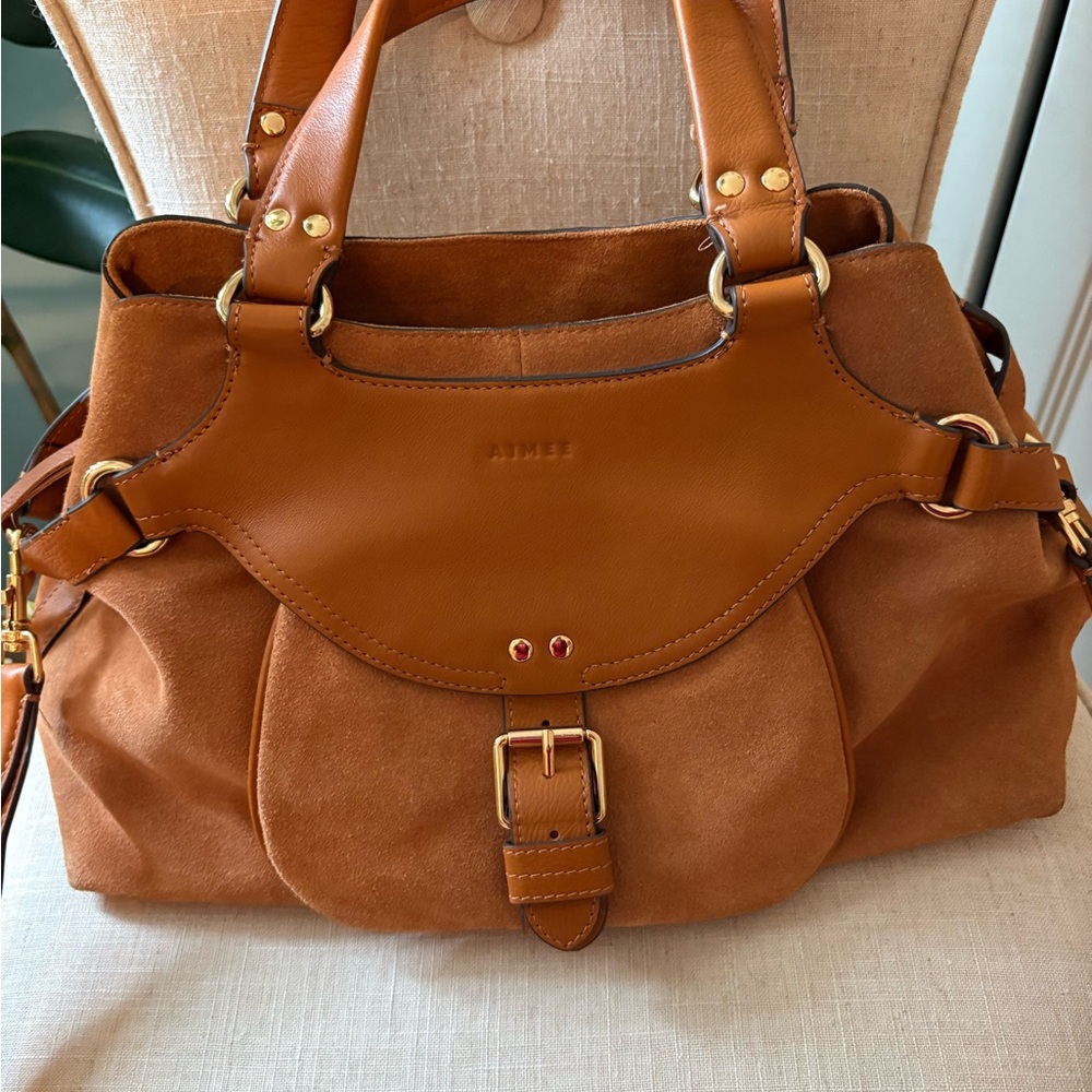 Aimee leather bag with many pockets and closures. Very strong magnets. 17” X 15”